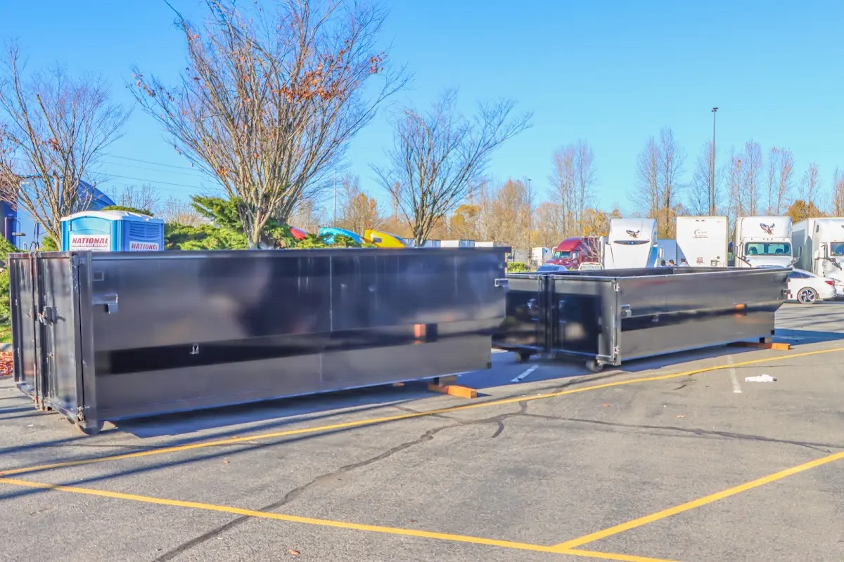 Professional dumpster rental service with roll-off container on residential driveway in Zephyrhills West